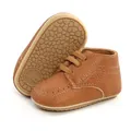 Professional close-up of brown baby PU leather walking shoes with soft non-slip sole - 12cm / Brown