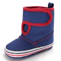 Detailed side view of navy blue baby walking boots with red trim and soft striped sole - Light Blue
