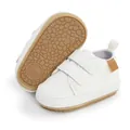 Detailed view of white baby pre-walker sneakers with double velcro and anti-slip sole - 12cm / White
