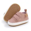 Detailed macro view of pink baby walking shoes featuring a non-slip textured rubber sole - 11cm / Pink
