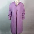 Detailed view of a long purple hooded knit cardigan sweater with ribbed texture for women - Purple