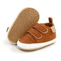 Detail view of brown baby walking shoes with anti-slip rubber soles and hook-and-loop straps. - 12cm / Brown
