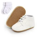 Close-up detail of white soft sole baby walking shoes with matching white socks. - 12cm / White (With Socks Set)