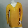 Detail shot of the yellow V-neck knit sweater featuring a front zipper and waffle texture. - S / Tops / Yellow