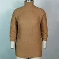 Detailed close-up of ribbed turtleneck and knit texture on this camel colored sweater - S / Dresses / Khaki