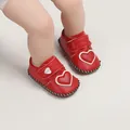 Close-up of red leather baby walker shoes with white heart patch and soft sole. - Insole Length 11cm / Heart Style (1168) / Red