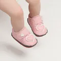 Close-up detail of pink baby walking shoes with heart applique worn by an infant - Insole Length 11cm / Heart Style (1168) / Pink