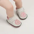 Detailed view of white leather baby shoes with pink flower decoration and soft sole. - Insole Length 11cm / Flower Style (1169) / White