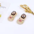 Detailed view of baby walking sock shoes featuring a cute yellow duck face design - Dark Khaki Duck