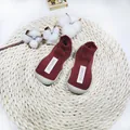 Red soft-soled baby walker sock shoes with non-slip grey rubber soles and fabric label. - Size 18/19 / Label Style / Dark Red