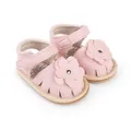 Detail view of pink baby prewalker sandals with flower decoration and Velcro strap - Pink