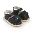 Detailed view of black baby prewalker sandals with decorative flower and velcro strap - Black