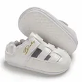 Close-up of white baby walking sandals with closed-toe design and anti-slip rubber sole - White