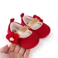 Detailed view of red velvet baby walking shoes with a golden strap and crochet flower. - Insole Length 11cm / Red
