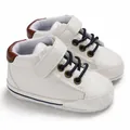 Detailed view of white high-top faux leather baby walker shoes with soft soles and straps - White