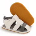 Close-up of white baby sandals with soft non-slip sole and hook-and-loop closure - White Rubber Sole