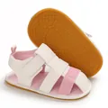 Close-up detail of infant summer sandals with pink canvas upper and soft rubber sole - Pink Rubber Sole