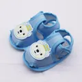 Detailed macro shot of blue baby sandals featuring a cute cartoon bear and soft fabric - Size 11 / Navy Bear Style / Blue
