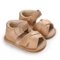 Close-up view of rose gold baby girl summer sandals with soft rubber non-slip soles - Gold