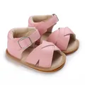 Detailed view of pink baby girl walking shoes featuring soft soles and buckle strap - Pink