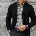 Detail shot of a black men's single-breasted knitted cardigan paired with a floral shirt - S / Tops / Black