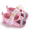 Detail view of pink metallic baby girl walking shoes with rainbow and star bow decoration - Pink