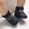 Close-up of navy blue baby high-top walking shoes with soft soles and velcro straps - Dark Blue