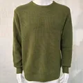 Close-up of olive green ribbed knit texture on a men's slim fit pullover sweater. - S / Tops / Green