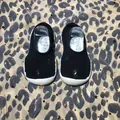 Detailed view of breathable knit baby sock shoes with perforated design and soft sole - 18/19 (11.5cm) / Black