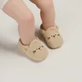 Soft knitted baby walking shoes featuring a cute cartoon cat face in a neutral beige color - Apricot