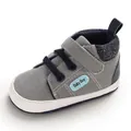 Graue Lauflernschuhe für Babys mit weicher Sohle, Klettverschluss und blauen Akzenten - Innenlänge 11cm / Grau