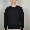 Close-up view of the unique pleated texture on the sleeves of a slim black men's knit sweater - S / Tops / Black