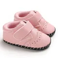 Detailed close-up view of pink handmade baby walking shoes with anti-slip rubber soles - 11cm / Pink