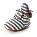 Detailed view of striped knitted baby bootie featuring soft and warm fleece lining - 11cm / Dark Gray Stripes