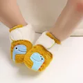 Close-up detail of yellow plush baby shoes featuring a blue cartoon dinosaur pattern - Inner Length 11cm / Yellow Dinosaur (H)
