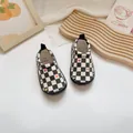 Checkered baby toddler canvas shoes with colorful heart patterns in a slip-on style. - Black & White Checkerboard