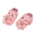 Close-up of pink knitted baby girl princess shoes with decorative flower design - 11cm / Pink
