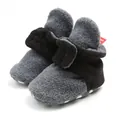 Close-up detail of warm grey fleece baby booties with soft soles for winter - 12cm / Grey Black Mix