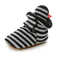 Detailed view of striped baby sock shoe with soft sole and warm fleece lining. - 11cm / Black Stripe