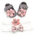 Macro detail of baby girl grey knitted shoes and white lace headbands with flowers - Gray