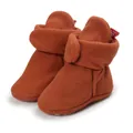 Detail view of warm terracotta fleece baby booties with soft soles and velcro straps - 11cm / Red Brown