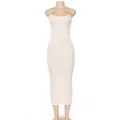Detailed view of a white ribbed bodycon midi dress with elegant spaghetti straps. - S / Dresses / White
