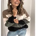 Detail view of a color-block striped knitted sweater with a cozy round neck design. - S / Tops / Grey Black