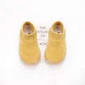 Top view of breathable yellow knit baby sock shoes with flexible soft rubber soles - Size 22 (Inner 13cm) / Turmeric