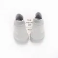 Detailed top-down view of breathable grey knit baby sock shoes with flexible rubber soles - Gray