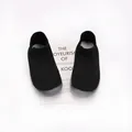 Detailed view of breathable black knit toddler sock shoes with flexible grey soles. - Size 22 (Inner 13cm) / Black