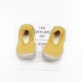 Detailed top view of yellow knit baby sock shoes with breathable and soft rubber soles - Yellow Gold Thread