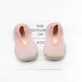 Detailed top view of pink breathable knit baby walker shoes featuring flexible rubber soles - Pink Gold Line