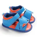 Detailed view of blue cartoon shark baby sandals featuring soft soles and secure velcro straps - Sapphire Blue
