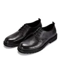 Detailed macro view of black vintage cowhide leather shoes with thick rubber soles - 38 / Black